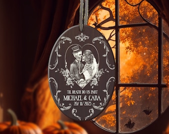 May include: A wooden oval ornament with a black and white image of a skeleton couple in a heart-shaped frame. The text "Til death do us part" is above the couple's names, "Michael & Cara", and the date "20/11/2023".