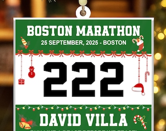 May include: A square Christmas ornament with the text "BOSTON MARATHON" and "25 SEPTEMBER, 2025 - BOSTON". The number "222" is prominently displayed, along with the name "DAVID VILLA" and the phrase "RUN LIKE A BEAST BEFORE WE FEAST!"