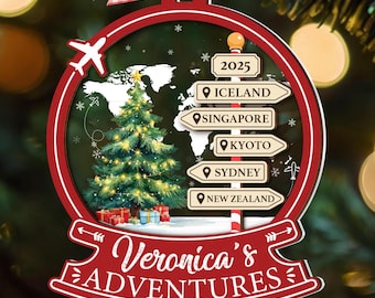 May include: A personalized Christmas ornament with a red border and a world map design. Inside, a Christmas tree, gift boxes, and directional signs point to Iceland, Singapore, Kyoto, Sydney, and New Zealand. The ornament reads "Veronica's ADVENTURES".