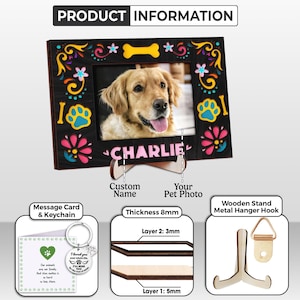 May include: A black wooden picture frame with a photo of a golden retriever named Charlie. The frame is decorated with colorful floral and paw print designs. Includes a message card and keychain.