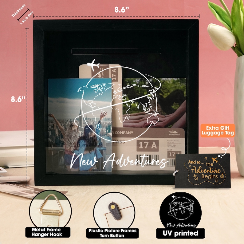 May include: Black wooden shadow box with a clear front, featuring a globe graphic, travel ticket, and a photo of two people. The box has a slot for inserting money or other items. The text "New Adventures" is printed on the front of the box. The box is 8.6 inches wide and 8.6 inches tall.