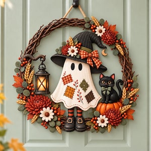 May include: A decorative wreath featuring a central ghost figure wearing a black hat with a plaid bow, a black cat sitting on a pumpkin, and a hanging lantern. The wreath is adorned with autumn-colored flowers, wheat stalks, and berries.