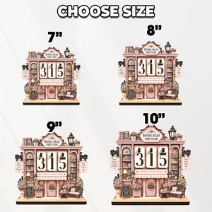 May include: Four pink bookstore-themed wooden displays labeled CHOOSE SIZE with heights of 7, 8, 9, and 10 inches. Each features a central counter with the number 315, shelves of books, a lamp, a bench, and text reading BOOKS READ THIS YEAR.