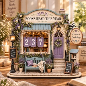 May include: A miniature bookstore model titled Books Read This Year with a purple door, a blue bench, and a hanging sign reading Emma's Bookshop. The facade features floral accents, a street lamp, and three hanging purple signs displaying the number 237.