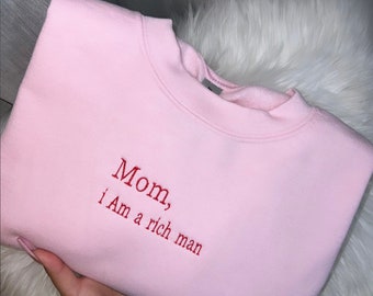 mom, i am a rich man” embroidered crewneck