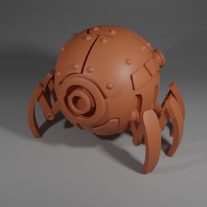 May include: A brown, spherical robot with multiple legs and a circular opening on the front. The robot has a textured surface and appears to be made of metal.