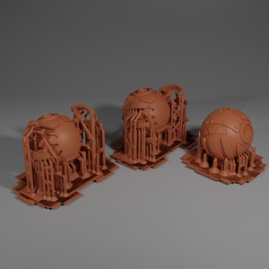 May include: Three 3D printed models of spheres with intricate, detailed, geometric designs. The spheres are surrounded by a lattice of smaller structures, creating a complex and futuristic aesthetic.