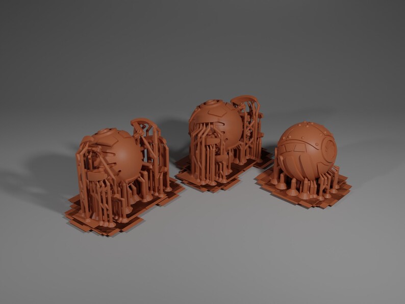 May include: Three 3D printed models of spheres with intricate, detailed, geometric designs. The spheres are surrounded by a lattice of smaller structures, creating a complex and futuristic aesthetic.