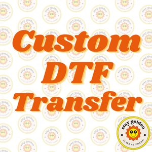 May include: Orange text on a white background with a repeating pattern of yellow circles with a sun face and the text "Stay Golden Always Fresh". The text reads "Custom DTF Transfer".