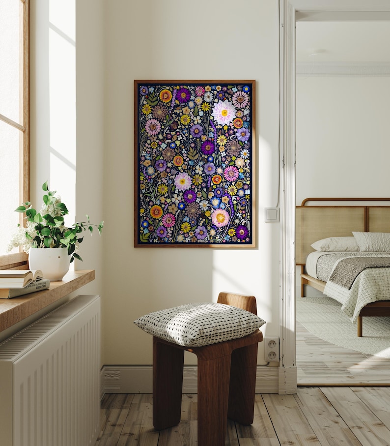 May include: A rectangular wall art print featuring a dense, colorful pattern of various flowers including daisies, zinnias, and small blossoms in shades of purple, pink, yellow, and orange set against a dark navy blue background in a wood frame.