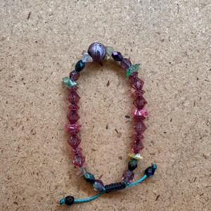 hand made beaded bracelet with purple center stone