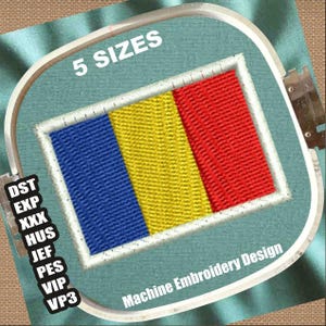 May include: Machine embroidery design featuring a rectangular flag with blue, yellow, and red vertical stripes, framed in white. The text "5 SIZES" is above the flag, and "Machine Embroidery Design" is below. The design is in an embroidery hoop.