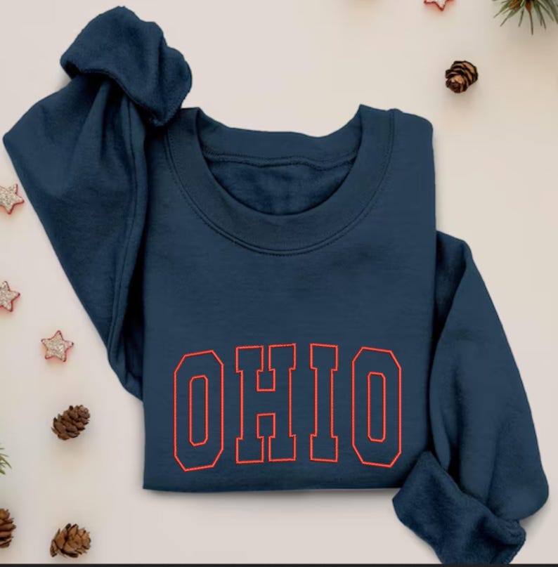 May include: A navy blue sweatshirt with the word "OHIO" in red outlined letters.