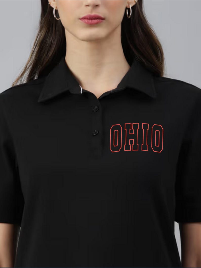 May include: Black polo shirt with a red outline of the word "OHIO" on the front.