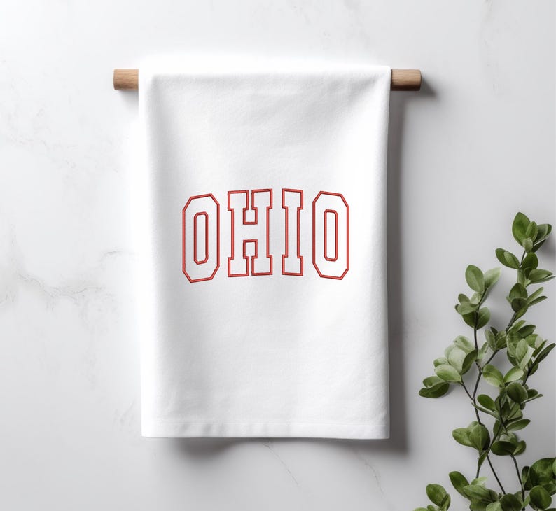 May include: White kitchen towel with the word "OHIO" printed in red with a white outline.