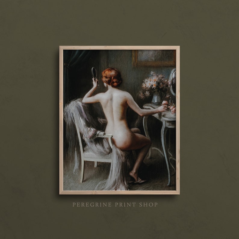 May include: A painting of a woman sitting in a chair in front of a vanity. She is holding a hand mirror and looking at her reflection. The woman has red hair and is nude. The vanity is decorated with flowers and a small mirror. The painting is done in a realistic style and has a warm color palette.