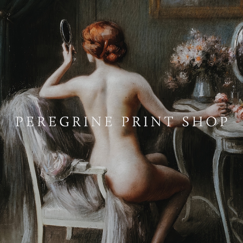May include: A woman sits on a white chair, looking at herself in a hand mirror. She is nude and has red hair. The background is a dark room with a vanity table and flowers.