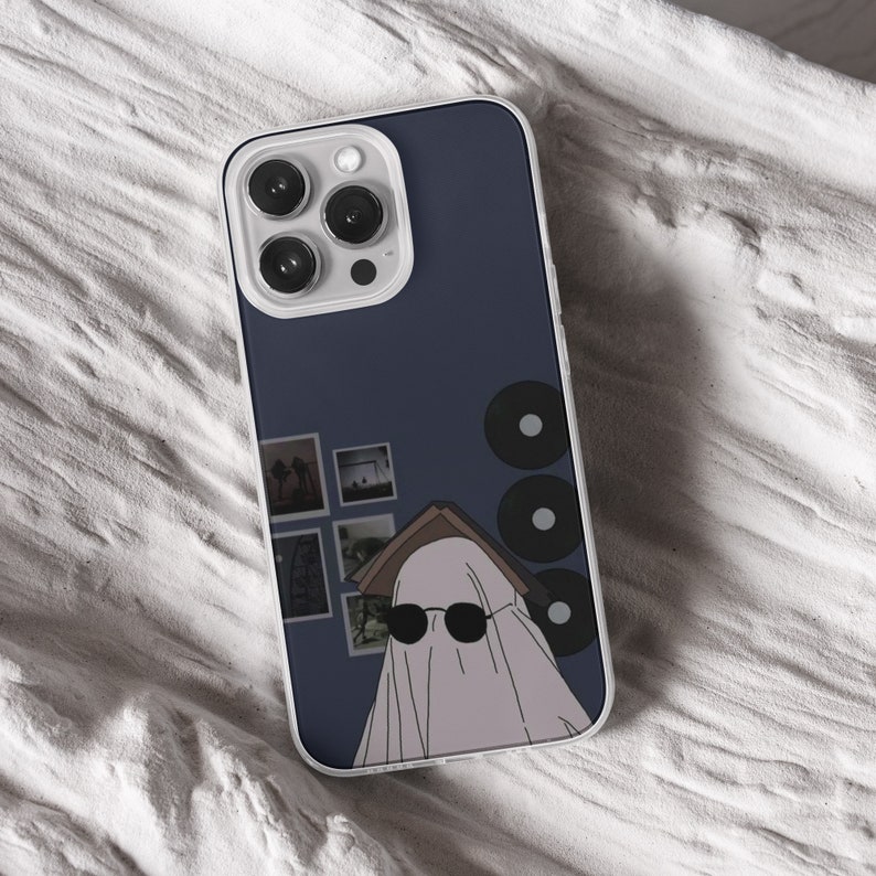 iPhone 15 Pro Max 14 Plus13 12 11 clear case with Ghost Halloween design on it, there are total of five options to choose from. Aesthetic spooky Halloween, flowers red and violet, camping ghosts, horror and goth artworks are depicted.