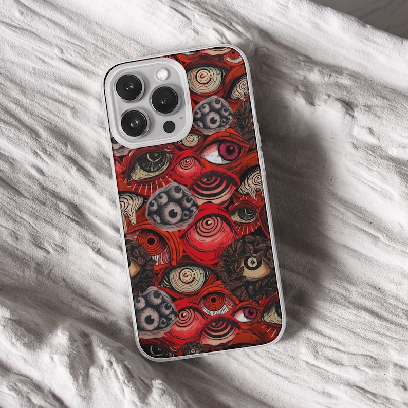 iPhone 15 Pro Max 14 Plus 13 12 11 clear case with Horror Grunge eyes design on it, there are total of five phone cover options to choose from. Halloween, spooky, black cat, mushroom, gothic artworks cover are depicted.