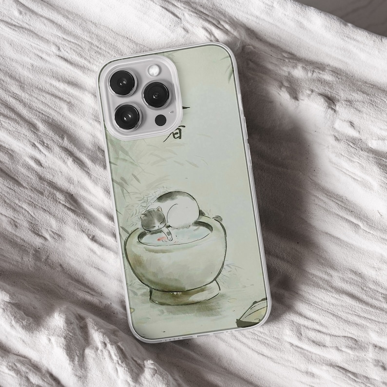 iPhone 15 Pro Max 14 Plus 13 12 11 clear case with Aesthetic cat design on it, there are total of five phone cover options to choose from. Funny kitty, cute pet animal, feline, flowers, japanese style, adorable artwork cover are depicted.