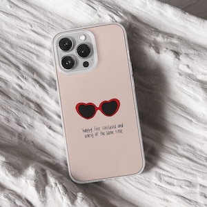 iPhone 15 Pro Max 14 Plus 13 12 11 clear case with Taylor Swift aesthetic design on it, there are total of five phone cover options to choose from. Music Song lyrics, Midnights, Folklore, pastel, evermore, 1989 cover artworks are depicted.