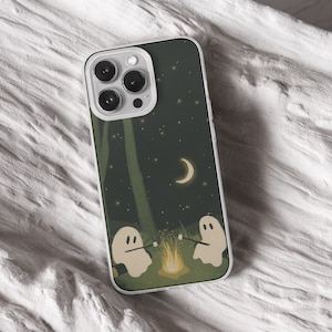 iPhone 15 Pro Max 14 Plus13 12 11 clear case with Ghost Halloween design on it, there are total of five options to choose from. Aesthetic spooky Halloween, flowers red and violet, camping ghosts, horror and goth artworks are depicted.