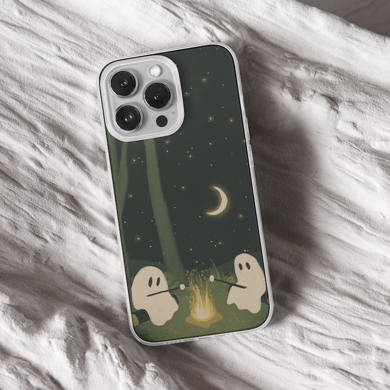 iPhone 15 Pro Max 14 Plus13 12 11 clear case with Ghost Halloween design on it, there are total of five options to choose from. Aesthetic spooky Halloween, flowers red and violet, camping ghosts, horror and goth artworks are depicted.