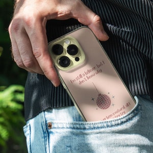 iPhone 15 Pro Max 14 Plus 13 12 11 clear case with Taylor Swift aesthetic design on it, there are total of five phone cover options to choose from. Music Song lyrics, Midnights, Folklore, pastel, evermore, 1989 cover artworks are depicted.