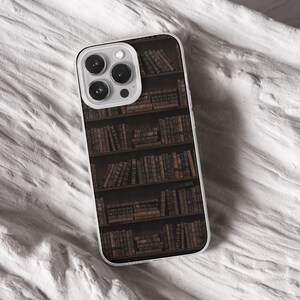 iPhone 15 Pro Max 14 Plus 13 12 11 clear case with Dark academia design on it, there are total of five phone cover options to choose from. Gothic, book lover, darkcore, castle, dark aesthetic, clouds and old aesthetic artwork depicted.