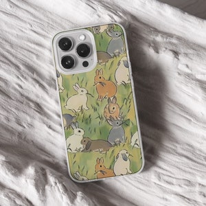 iPhone 15 14 13 12 11 clear case with Cute Bunny design on it, there are total of five phone cover options to choose from. Nature core rabbit, cottage core flower pattern, farm life, carrot, animal cover artwork are depicted.