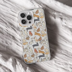 iPhone 15 14 13 12 11 clear case with Cute Bunny design on it, there are total of five phone cover options to choose from. Nature core rabbit, cottage core flower pattern, farm life, carrot, animal cover artwork are depicted.