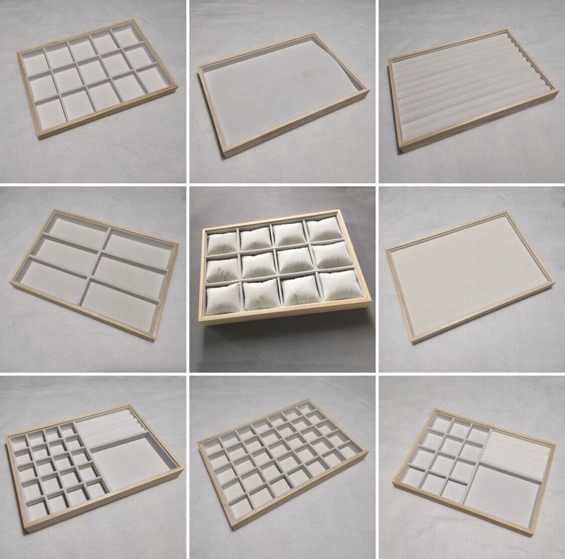 May include: Set of nine different sized wooden jewelry trays with white felt lining. The trays are perfect for organizing and displaying rings, earrings, necklaces, and other jewelry.