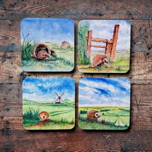Four Hedgehog Coasters set from original watercolours, based on a story of a Hedgehog on the Sussex Southdowns for charity