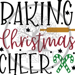 May include: A festive graphic with the words "Baking Christmas Cheer" in black and red script. A rolling pin, stars, and candy canes are included in the design. The words "Oak Hill Design" are also present.