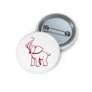 May include: A white button with a red outline of an elephant with its trunk raised in the air.