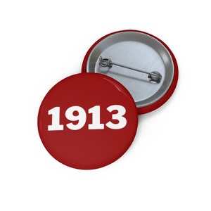 May include: Red button with the number 1913 in white text.