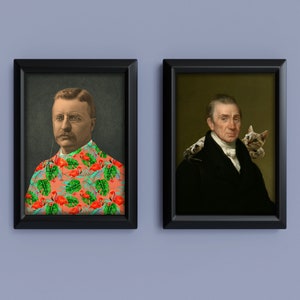 May include: Two framed art prints. One features a portrait of a man in a pink shirt with a tropical flamingo and leaf pattern. The other shows a man in a black coat with a tabby cat on his shoulder. Both are in black frames.