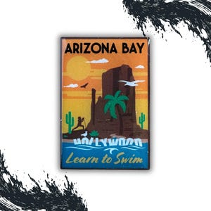 May include: A vintage-style illustration of a desert landscape with a large rock formation, palm trees, and a hiker. The text "Arizona Bay" is at the top of the image, and "Learn to Swim" is at the bottom. The image has a retro, travel poster aesthetic.