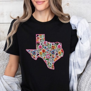 Woman wearing a beautiful faux embroidered Texas shirt