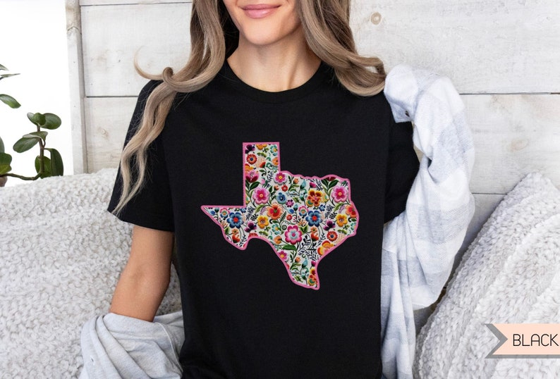 Woman wearing a beautiful faux embroidered Texas shirt