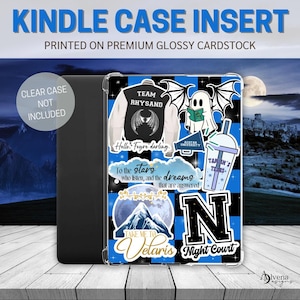 May include: Kindle case insert with a blue and black checkered design. The insert features various graphics, including a jacket that says "Team Rhysand", a ghost reading a book, and the text "Take me to Velaris". The text "Kindle Case Insert" is at the top.