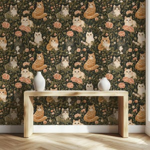 May include: Wallpaper featuring a repeating pattern of various cat breeds in shades of orange, gray, and white, set against a dark green background with pink floral accents. Two white vases sit on a light wood table.