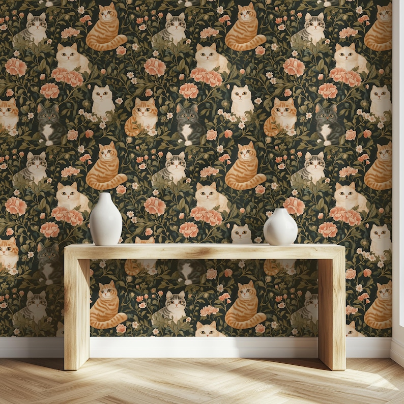 May include: Wallpaper featuring a repeating pattern of various cat breeds in shades of orange, gray, and white, set against a dark green background with pink floral accents. Two white vases sit on a light wood table.
