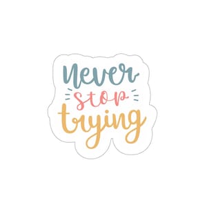 May include: A sticker with a white background and a blue, pink, and yellow design. The sticker says "Never stop trying."