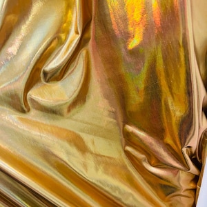 Liquid shinny gold 4way stretch spandex great fabrics for dress jacket skirt pants  and more made in ITALY
