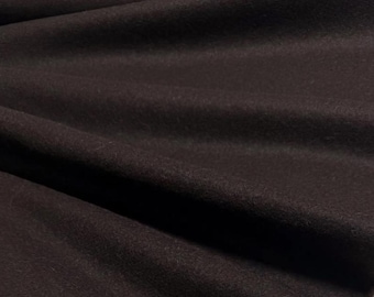 May include: Close-up of a dark brown fabric with visible folds and a soft texture. The material appears to be a heavy weight, possibly wool or a wool blend, suitable for apparel or home decor projects.
