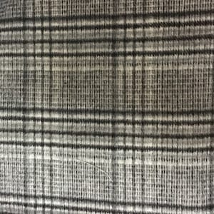 May include: A close-up of a gray and white plaid fabric with a subtle texture.