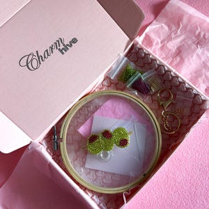 May include: A set of three ceramic mugs with a speckled, matte finish in cream, light brown, and dark brown. Each mug has a simple design and a rounded handle.