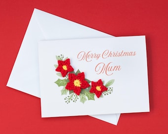 Może przedstawiać: Biała kartka z czerwono-żółtym haftem kwiatowym i tekstem "Merry Christmas Mum".