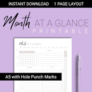May include: A printable monthly calendar planner with a simple design. The calendar includes a section for goals, to-do lists, and a weekly grid. The calendar is A5 size with hole punch marks.